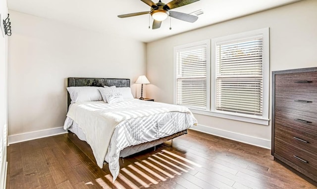 bedroom featuring dark hardwood / wood-style floors and ceiling fan