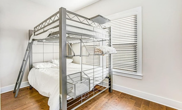 bedroom with wood-type flooring