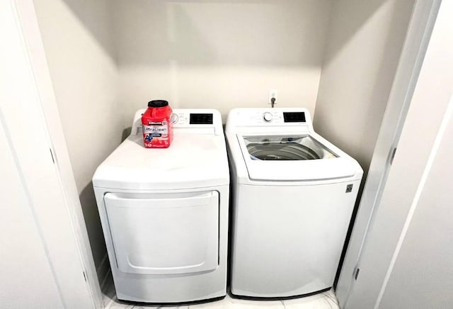 laundry area with independent washer and dryer