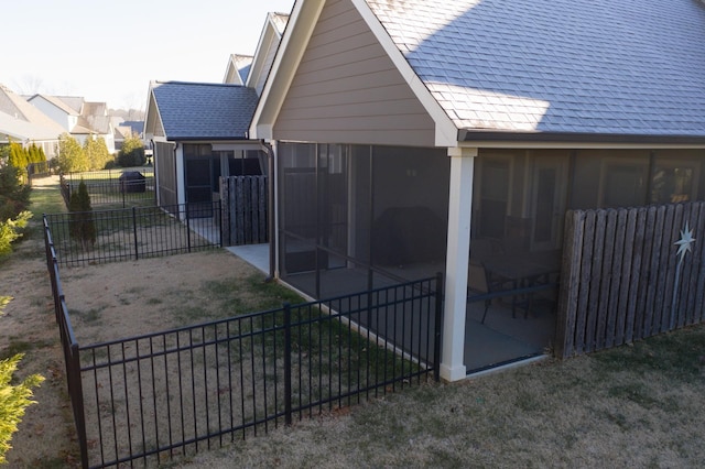 exterior space featuring a sunroom and a patio area