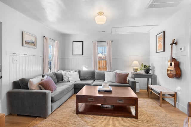 living room with light hardwood / wood-style flooring