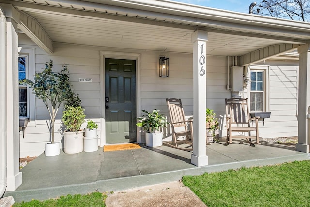 doorway to property featuring covered porch