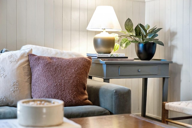 living area featuring wood walls