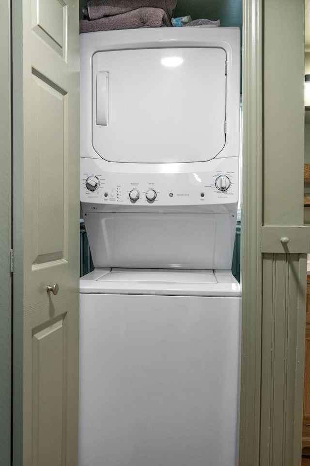 washroom with stacked washer and clothes dryer