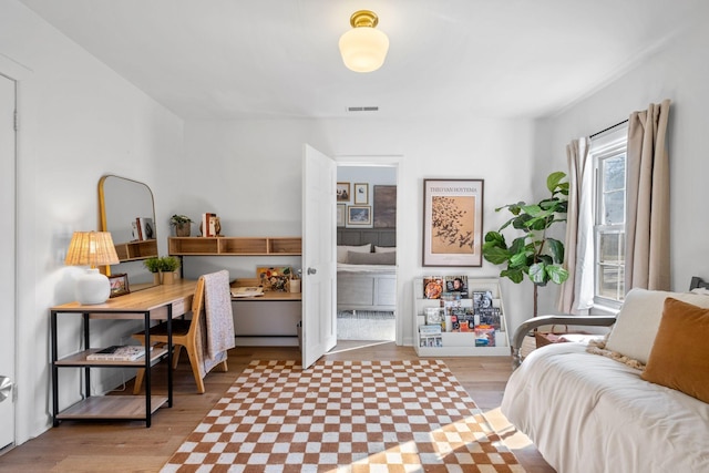 sitting room featuring light hardwood / wood-style flooring