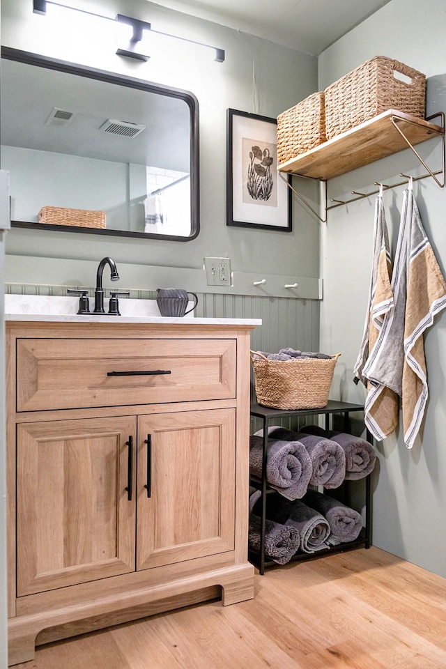 bathroom featuring vanity and wood-type flooring