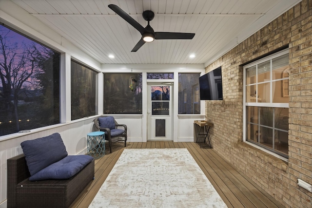 sunroom / solarium with ceiling fan