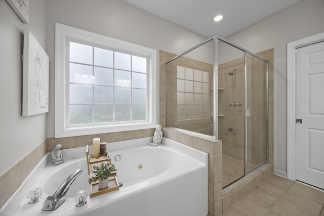 bathroom featuring tile patterned flooring and plus walk in shower