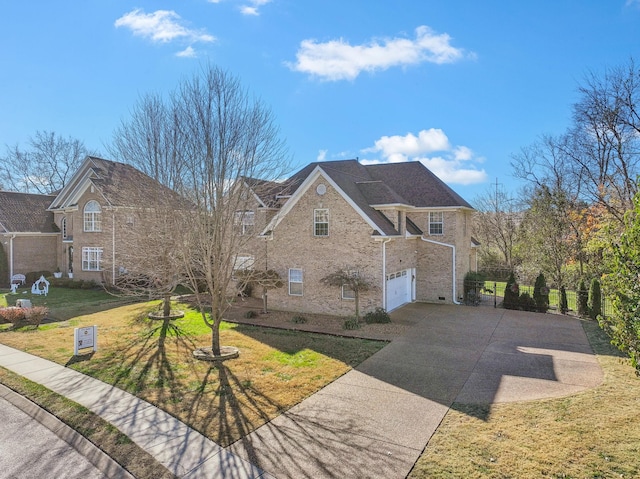 view of front of home with a garage and a front yard