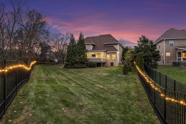 view of yard at dusk