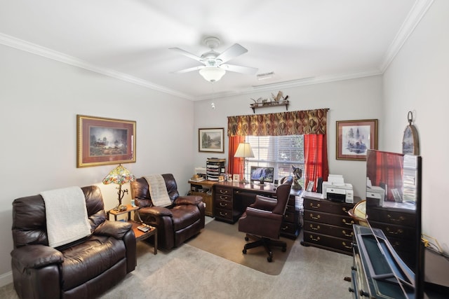 carpeted office space featuring crown molding and ceiling fan