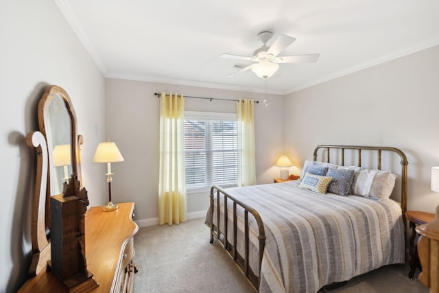 carpeted bedroom featuring ornamental molding and ceiling fan