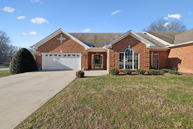 single story home featuring a garage and a front lawn