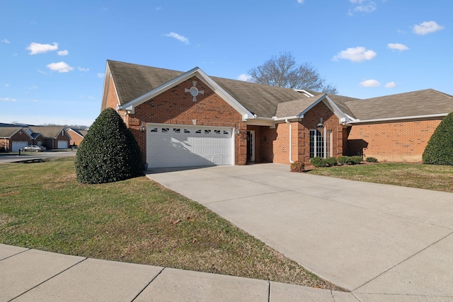 single story home with a garage and a front lawn