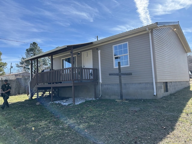 back of house with a yard