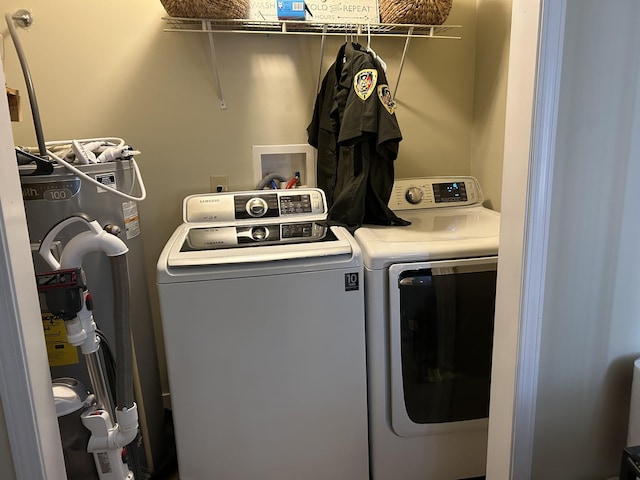 laundry area with washing machine and clothes dryer