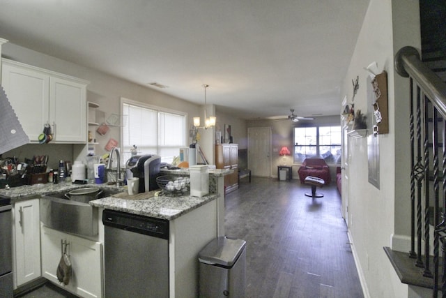 kitchen with decorative light fixtures, dishwasher, kitchen peninsula, and white cabinets