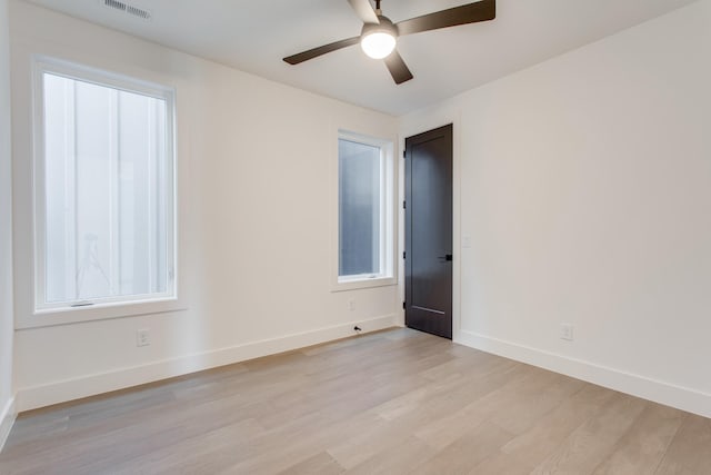 unfurnished room with light hardwood / wood-style flooring and ceiling fan