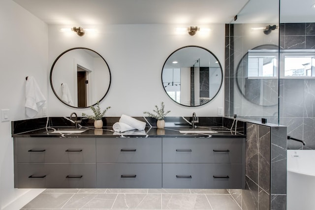 bathroom featuring a tub to relax in and vanity