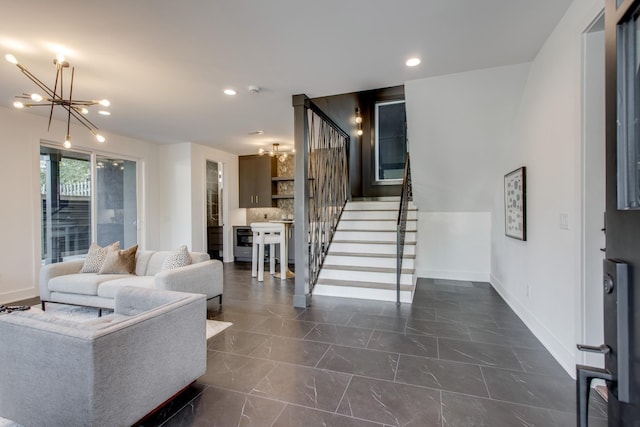 living room with an inviting chandelier and beverage cooler