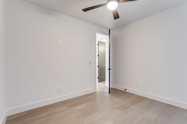 spare room featuring ceiling fan and light hardwood / wood-style floors