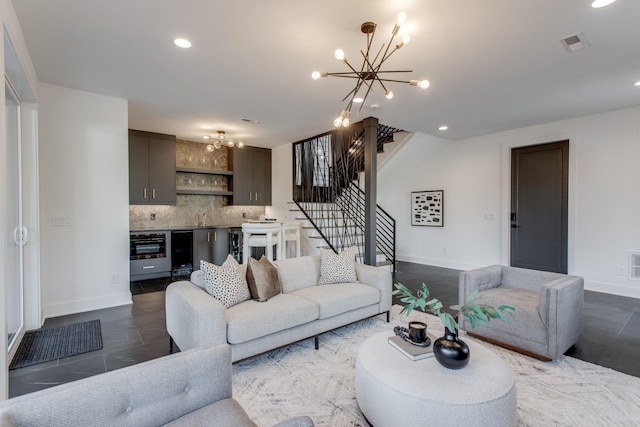 living room featuring indoor bar and an inviting chandelier