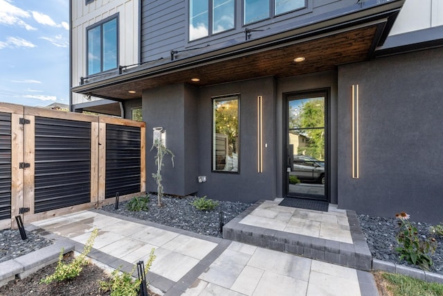 property entrance featuring a patio area