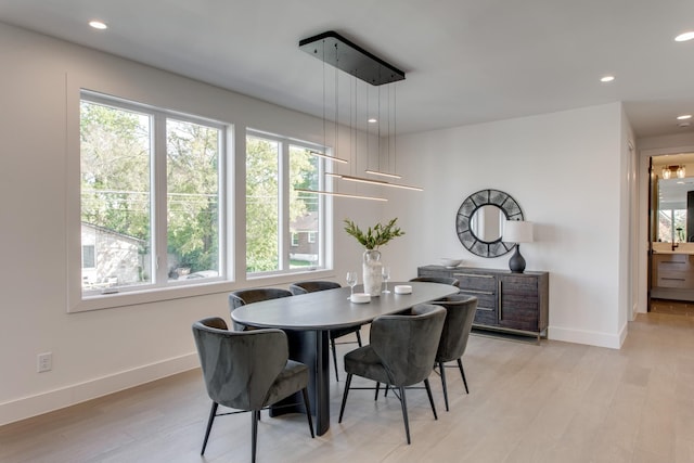 dining area with a healthy amount of sunlight and light wood-type flooring