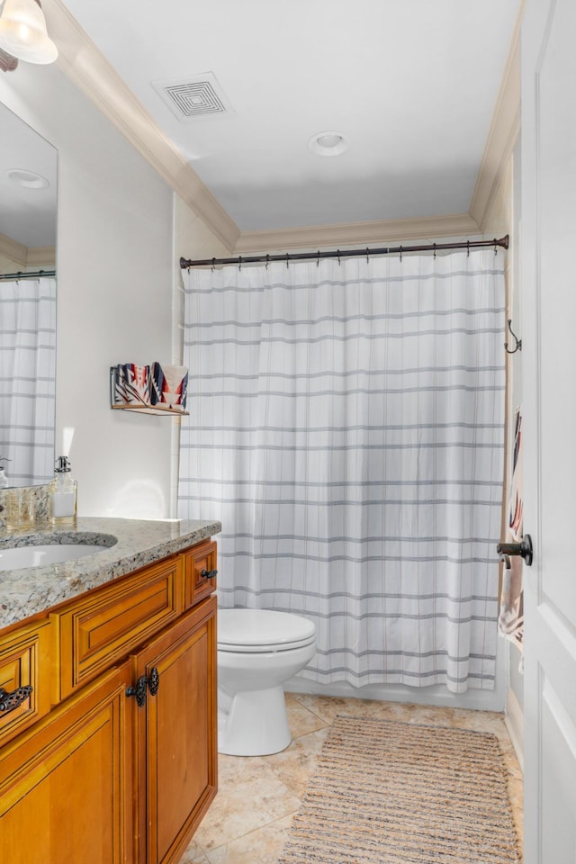 bathroom with vanity, tile patterned flooring, crown molding, and toilet