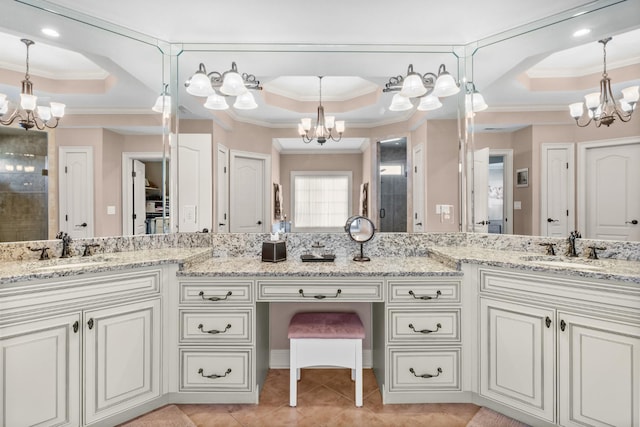 bathroom featuring vanity, a notable chandelier, and a raised ceiling