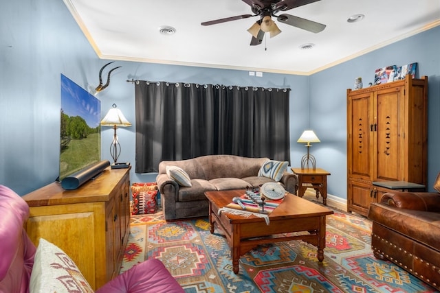 living room with crown molding and ceiling fan