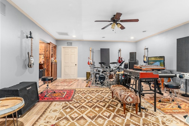 home office featuring crown molding, ceiling fan, and hardwood / wood-style flooring