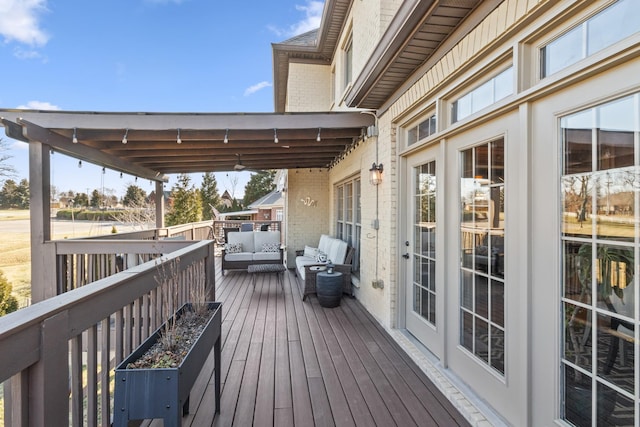 wooden terrace featuring outdoor lounge area