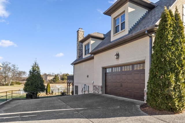 view of property exterior featuring a garage