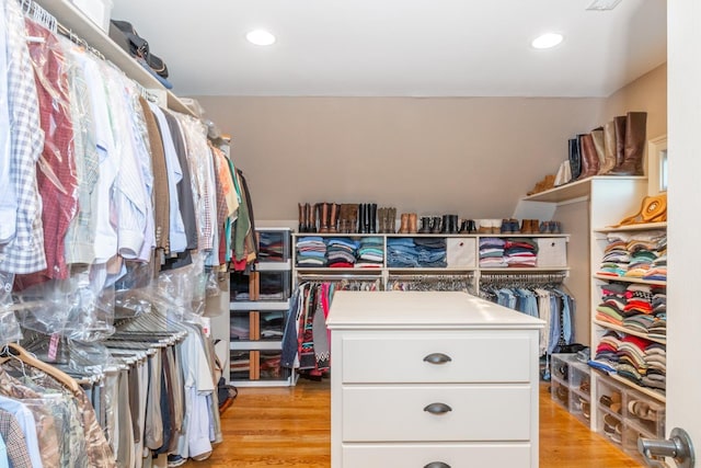 spacious closet with light hardwood / wood-style flooring