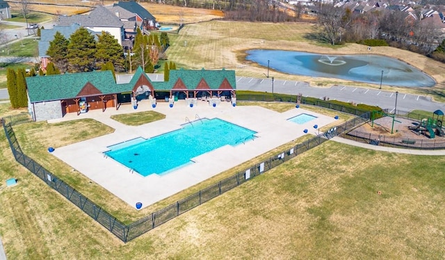 view of pool featuring a yard