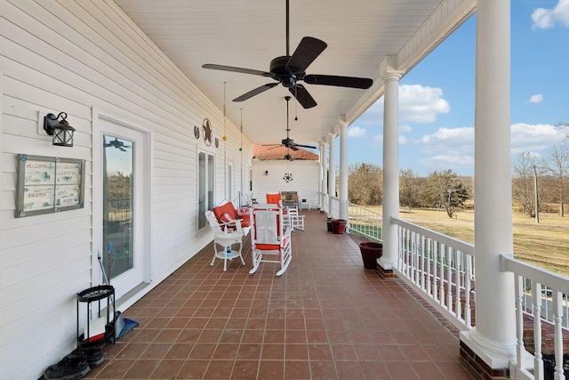 view of patio / terrace with ceiling fan and a porch