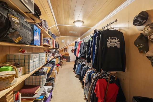 walk in closet featuring carpet flooring