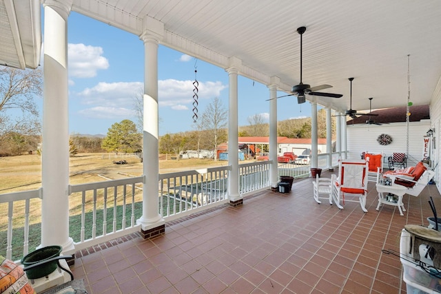 view of patio / terrace with ceiling fan and a porch