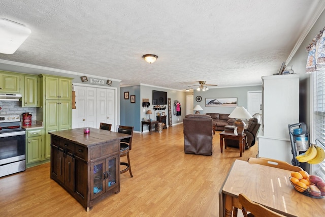 kitchen with ornamental molding, electric stove, and green cabinetry