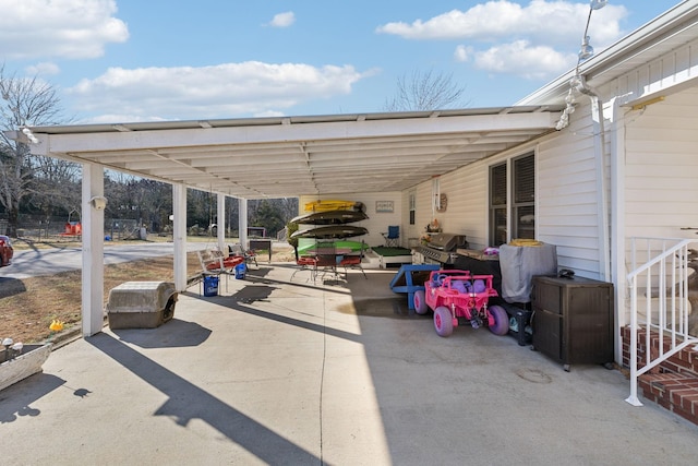 view of patio featuring grilling area and a carport