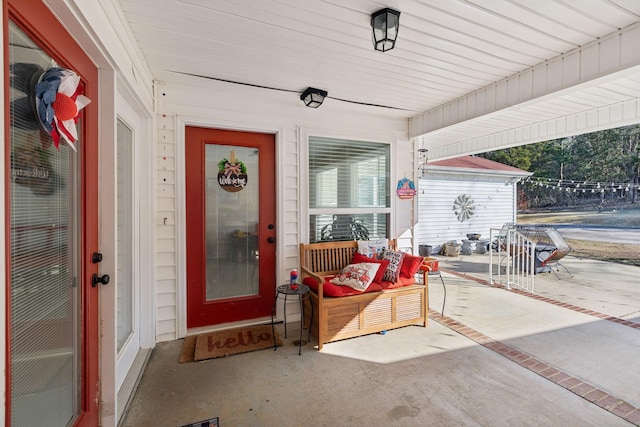 property entrance with a patio area