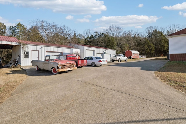 view of car parking featuring a garage