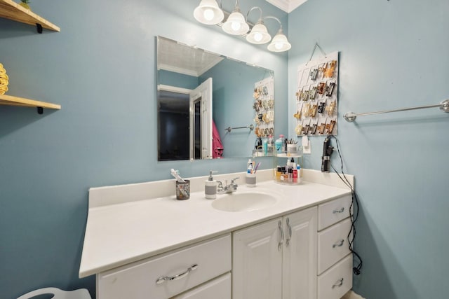 bathroom with vanity and crown molding