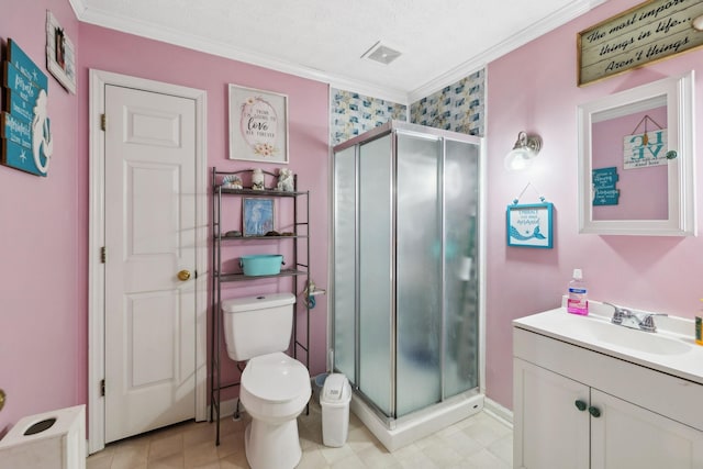 bathroom with a shower with door, vanity, ornamental molding, and toilet