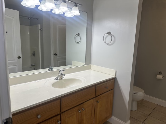 full bathroom with tile patterned flooring, vanity, bathing tub / shower combination, and toilet