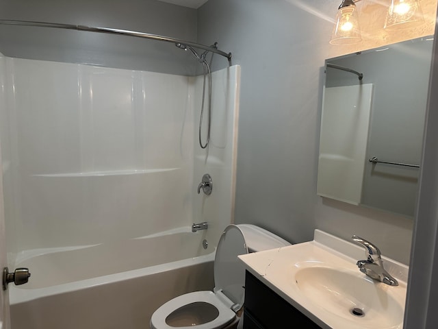 full bathroom featuring vanity, bathtub / shower combination, and toilet