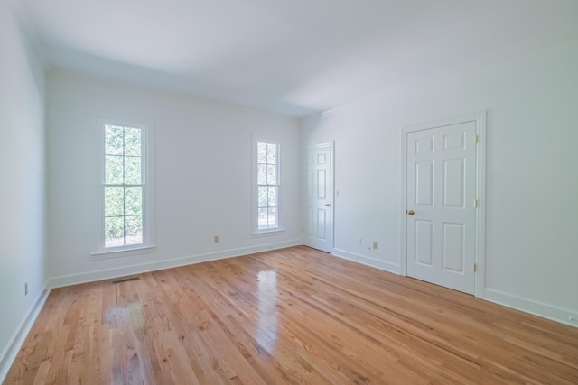 unfurnished room featuring light hardwood / wood-style flooring