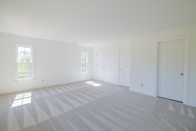 empty room featuring light carpet