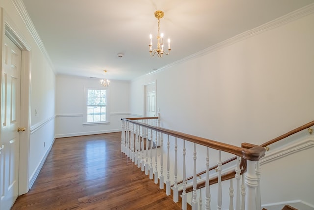 interior space with an inviting chandelier, crown molding, and wood-type flooring